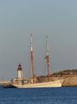 FZ027440 Old sailboat by lighthouse.jpg